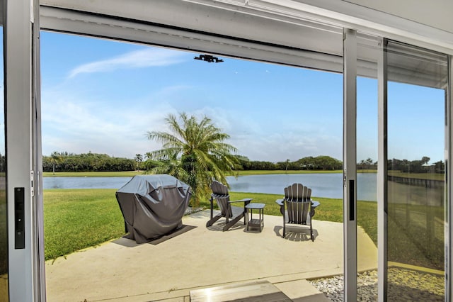 interior space featuring a water view and grilling area