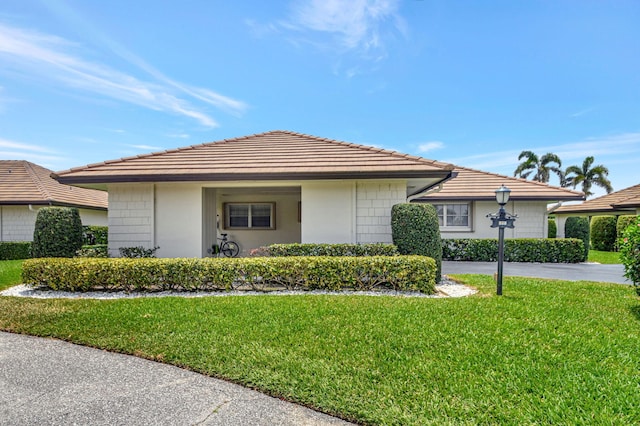 330 Cedar Key Cir, Atlantis, FL 33462 - single story home featuring a front lawn
