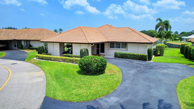 330 Cedar Key Cir, Atlantis, FL 33462 - single story home featuring a tile roof, stucco siding, driveway, and a front yard