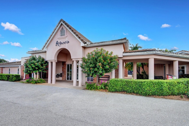 330 Cedar Key Cir, Atlantis, FL 33462 - view of front of home featuring stucco siding