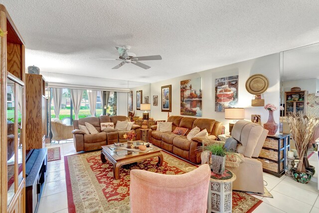 9668 Sills Dr Unit 101, Boynton Beach, FL 33437 - living room featuring ceiling fan, a textured ceiling, and light tile patterned floors