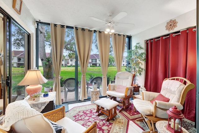 sunroom with ceiling fan