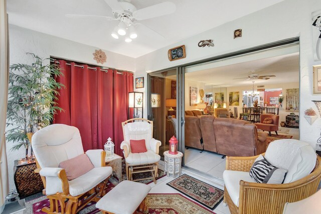 9668 Sills Dr Unit 101, Boynton Beach, FL 33437 - living room featuring a ceiling fan and tile patterned flooring
