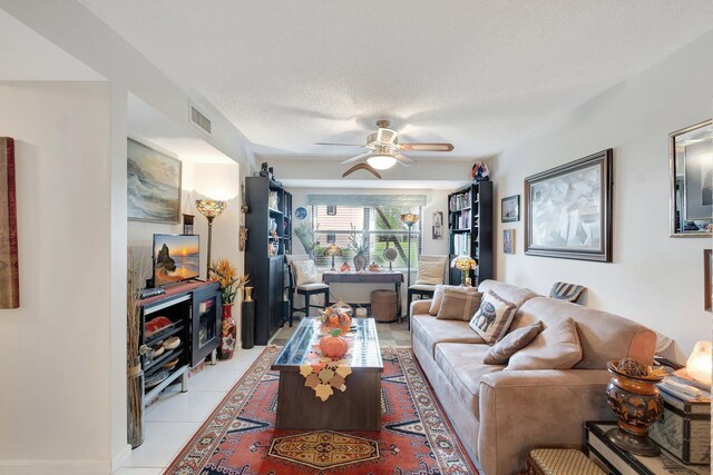 9668 Sills Dr Unit 101, Boynton Beach, FL 33437 - living room with ceiling fan, light tile patterned floors, and a textured ceiling