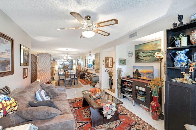 9668 Sills Dr Unit 101, Boynton Beach, FL 33437 - living room with light tile patterned flooring, a ceiling fan, a chandelier, and a textured ceiling