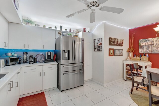 9668 Sills Dr Unit 101, Boynton Beach, FL 33437 - kitchen featuring stainless steel fridge with ice dispenser, light countertops, light tile patterned floors, and ceiling fan