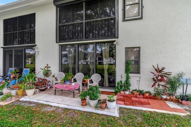 9668 Sills Dr Unit 101, Boynton Beach, FL 33437 - back of house featuring stucco siding and a patio area