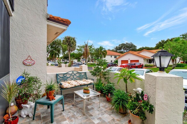9668 Sills Dr Unit 101, Boynton Beach, FL 33437 - view of patio / terrace with a residential view