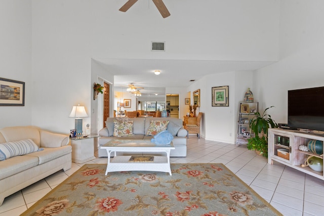 tiled living room with ceiling fan