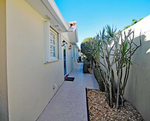 view of side of property featuring a patio area