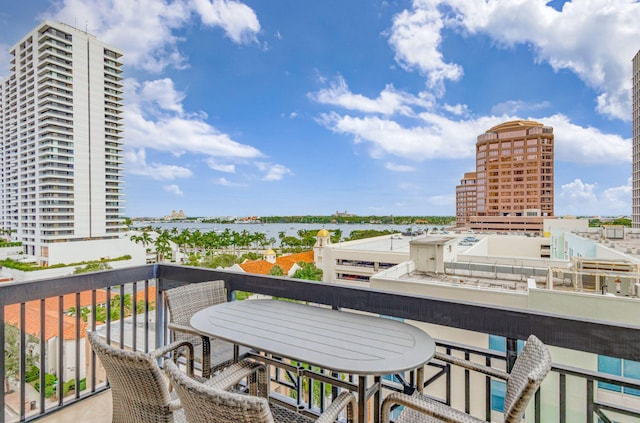 balcony featuring a water view