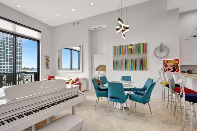 dining space featuring light tile patterned floors