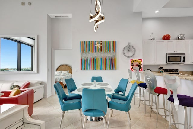 dining area with light tile patterned flooring