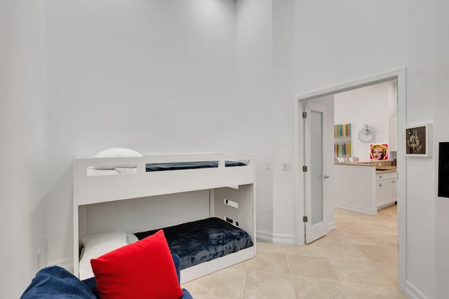 bedroom featuring light tile patterned floors