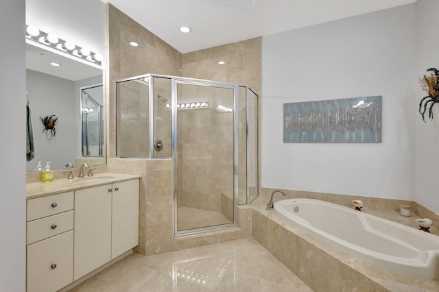 bathroom featuring tile patterned floors, vanity, and independent shower and bath