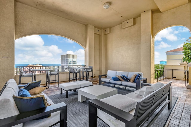 view of patio / terrace featuring an outdoor living space and a water view