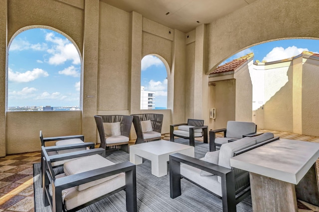 view of patio / terrace with a balcony and an outdoor hangout area