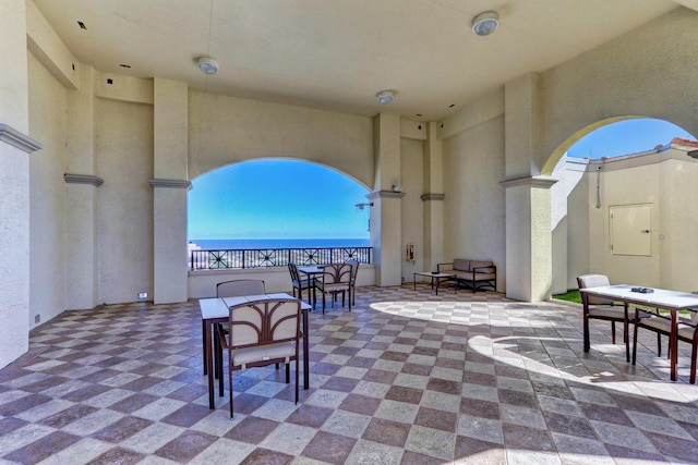 view of patio featuring a water view