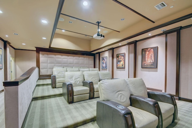 carpeted home theater with crown molding