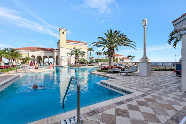 view of swimming pool with a patio area