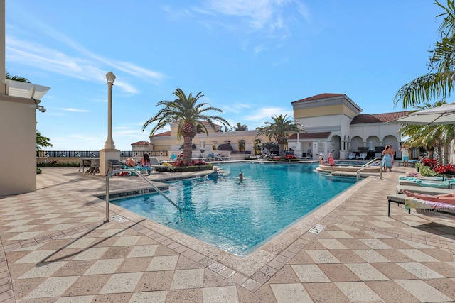 view of swimming pool featuring a patio