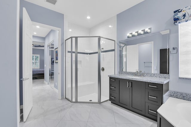 full bathroom featuring a stall shower, ensuite bath, marble finish floor, and vanity