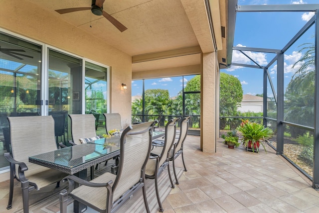 sunroom with a ceiling fan and a healthy amount of sunlight