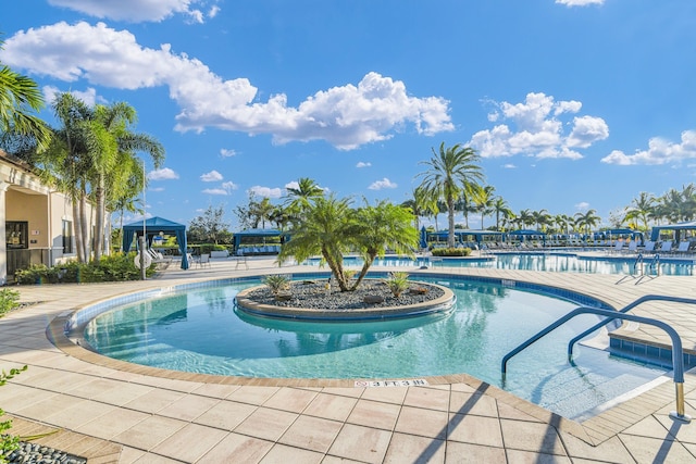 pool with a gazebo and a patio