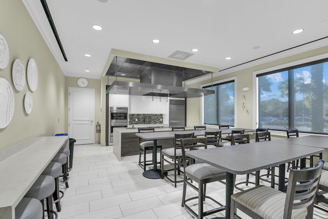 dining room featuring recessed lighting, visible vents, and crown molding