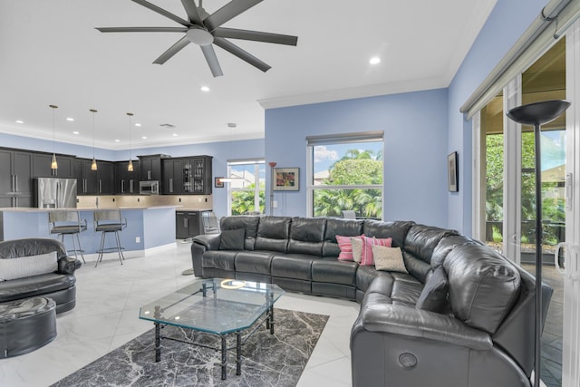 living area featuring recessed lighting, a ceiling fan, and crown molding