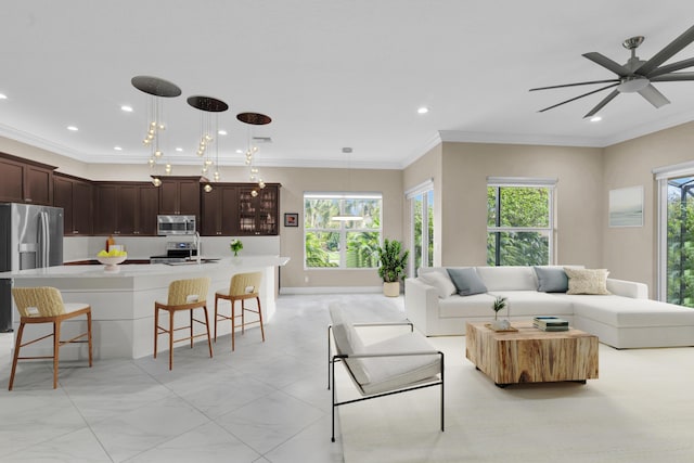 living room with baseboards, visible vents, crown molding, and recessed lighting