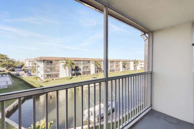 balcony featuring a water view