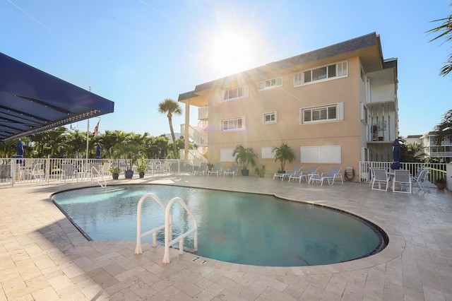 view of swimming pool with a patio area