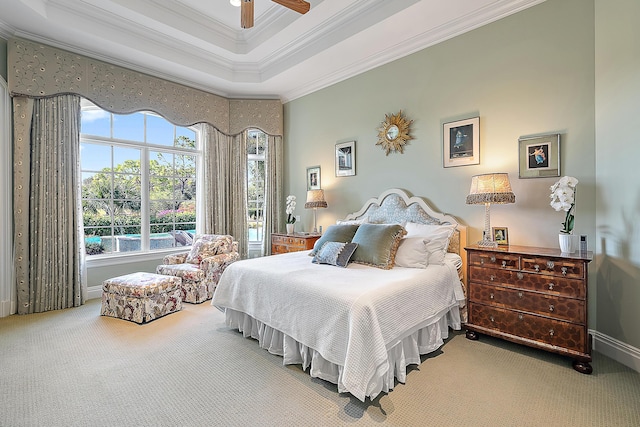 bedroom with multiple windows, carpet flooring, ceiling fan, and crown molding