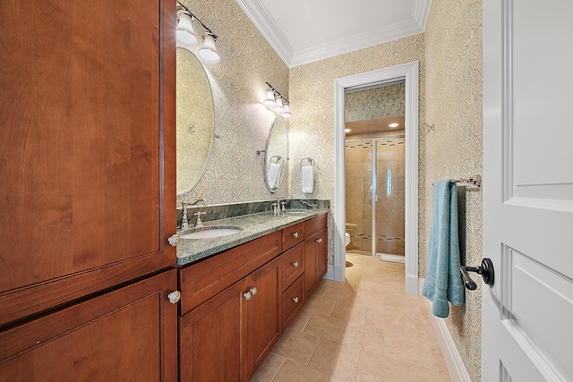 bathroom with vanity, toilet, an enclosed shower, and ornamental molding