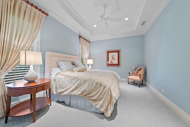 carpeted bedroom featuring a raised ceiling, ceiling fan, and crown molding