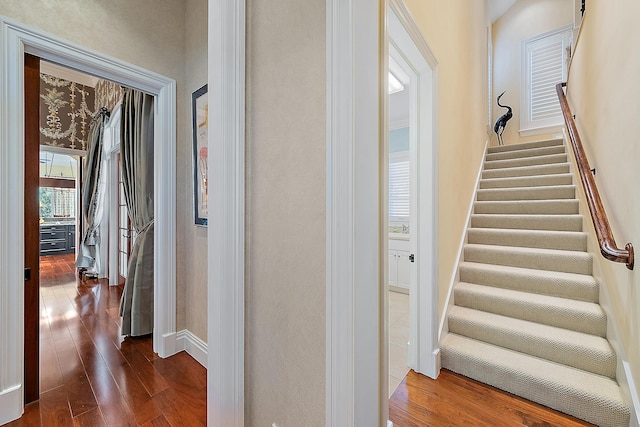 corridor featuring dark hardwood / wood-style floors