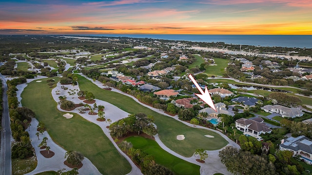 aerial view at dusk with a water view