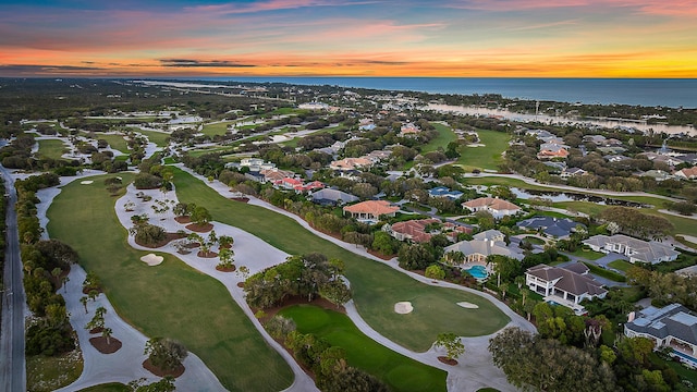 aerial view at dusk with a water view