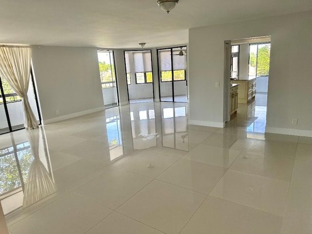 spare room with light tile patterned floors