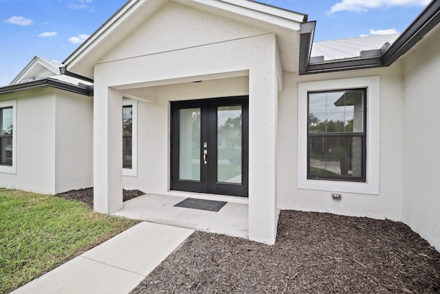 property entrance featuring french doors