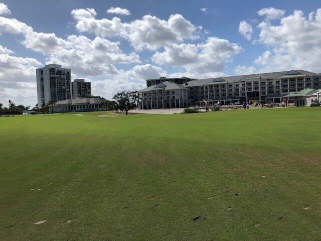 view of property's community with a lawn