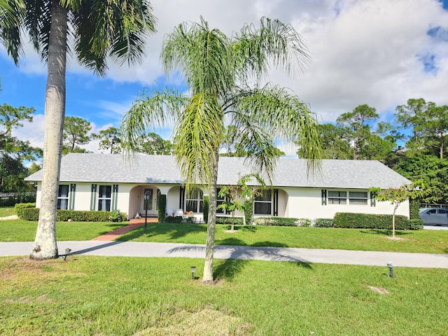 single story home with a front yard