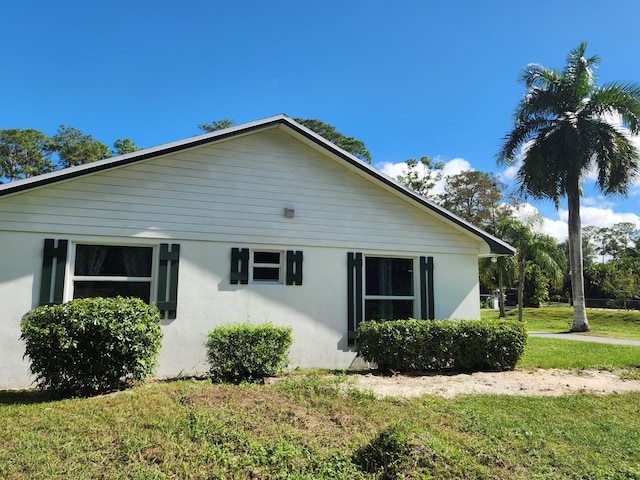 view of home's exterior featuring a yard