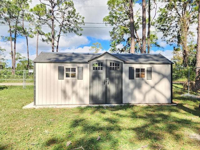 view of outdoor structure featuring a yard