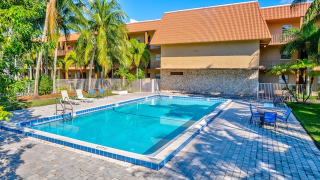 view of swimming pool with a patio