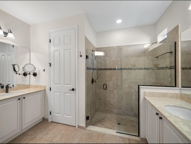 10313 SW Fernwood Ave, Port Saint Lucie, FL 34987 - full bathroom featuring a shower stall, two vanities, and tile patterned floors