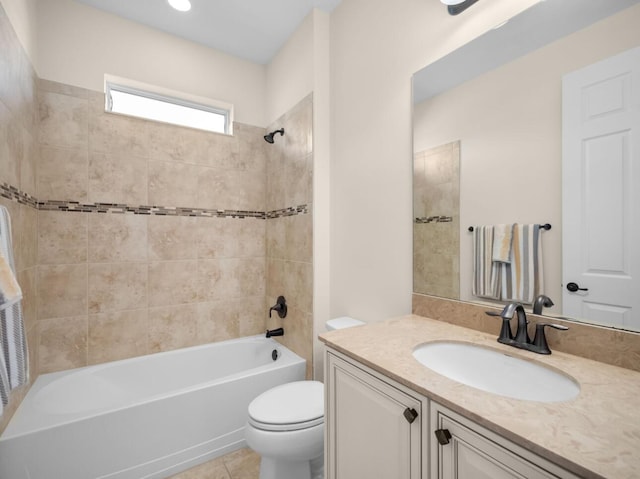 10313 SW Fernwood Ave, Port Saint Lucie, FL 34987 - bathroom featuring vanity, toilet, bathing tub / shower combination, and tile patterned floors