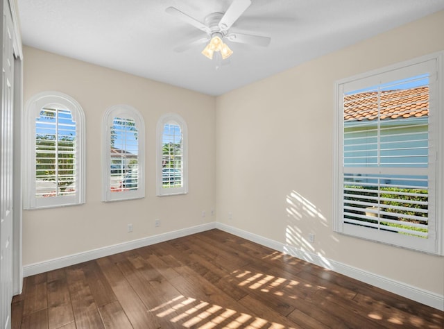 10313 SW Fernwood Ave, Port Saint Lucie, FL 34987 - spare room featuring hardwood / wood-style flooring, baseboards, and ceiling fan
