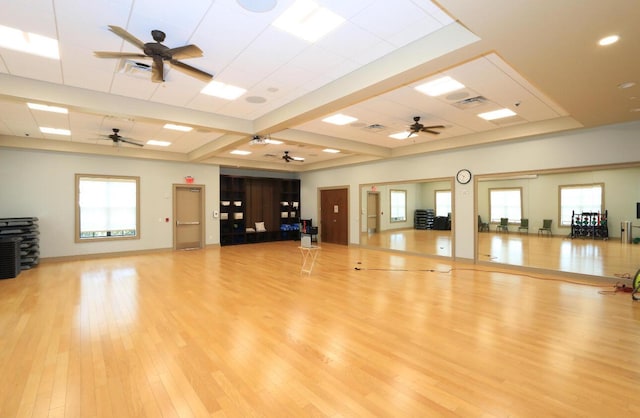 workout room featuring ceiling fan and light wood-type flooring